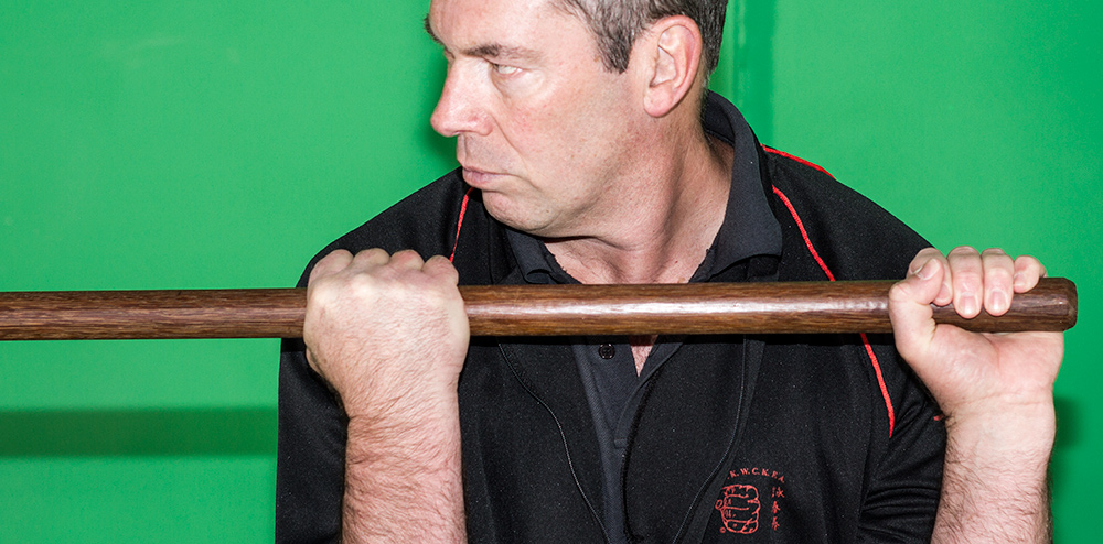 James Sinclair is seen demonstrating the Wing Chun Pole grips. The distance is between the hands is no wider than the shoulders.