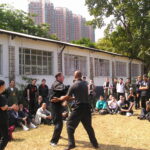 James Sinclair teaching in Hong Kong to a large outdoor audience at the 2nd World VTAA Conference. He was assisted by Master Mark Phillips of the London Wing Chun Academy. 2005.