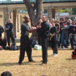 James Sinclair teaching in Hong Kong to a large outdoor audience at the 2nd World VTAA Conference. He was assisted by Master Mark Phillips of the London Wing Chun Academy. 2005