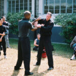 James Sinclair teaching in Hong Kong to a large outdoor audience at the 2nd World VTAA Conference. He was assisted by Master Mark Phillips of the London Wing Chun Academy. 2005.