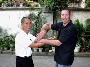 2005 Foshan China. James Sinclair and Master Fung Man pose in Chi Sau.