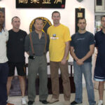 Grandmaster wan Kam Leung with James Sinclair and his students.